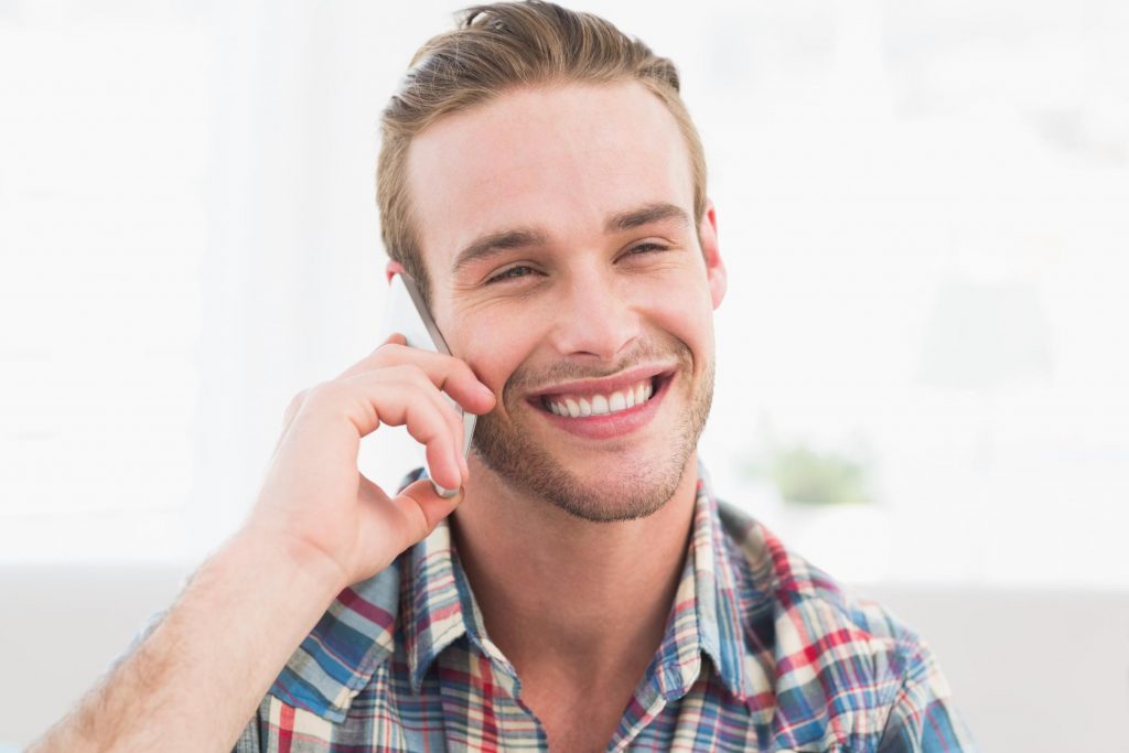 Baton Rouge Fence Company - Contact man smiling answering call